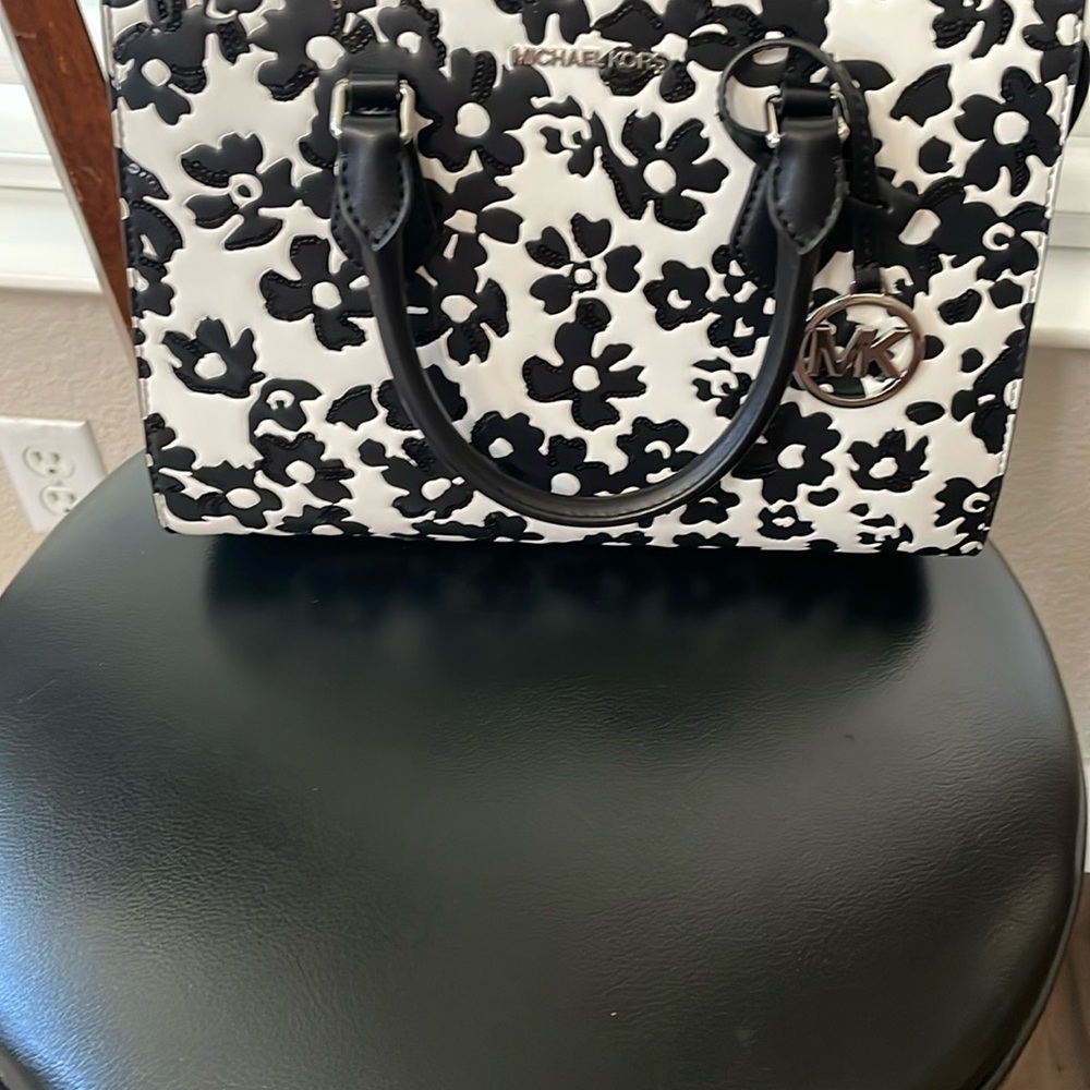 Michael Kors Black and White Floral Satchel with Elegant Detailing.